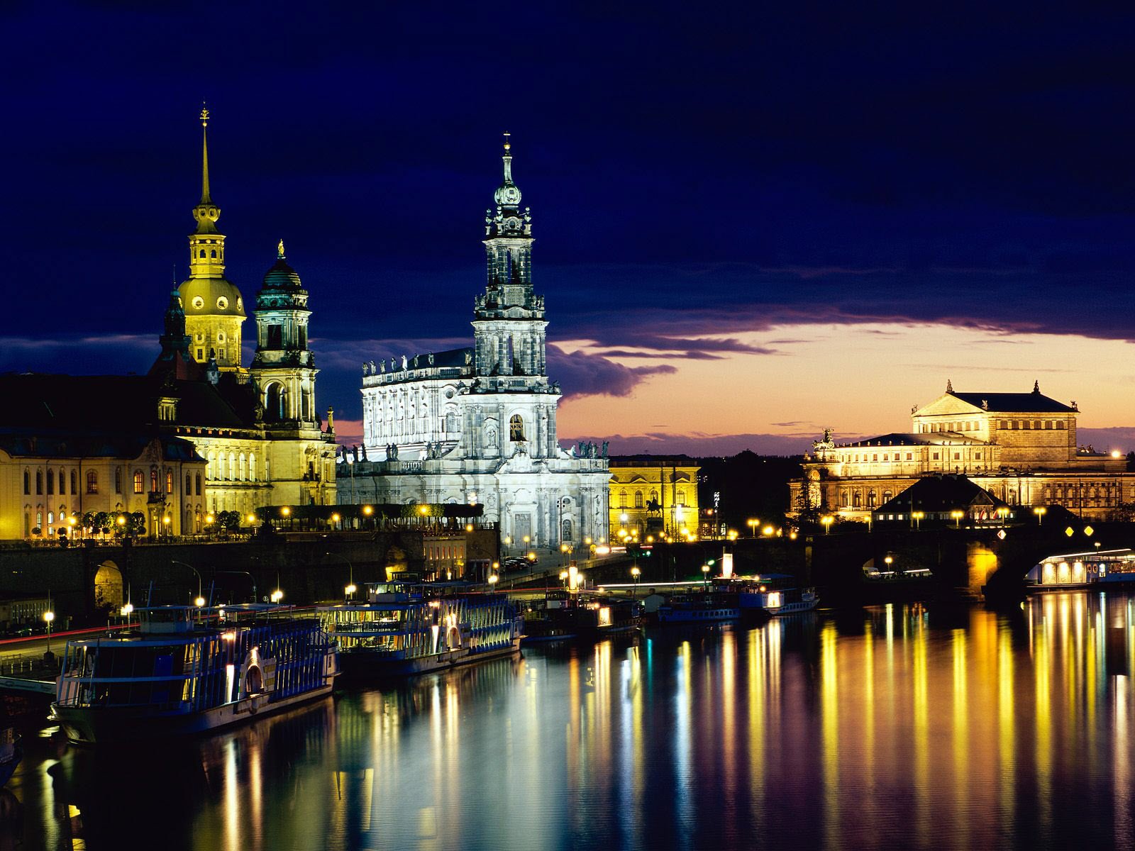 architectural structure the evening light tower city night the night sky the lights of the city. reflection water surface boats lights the dome building