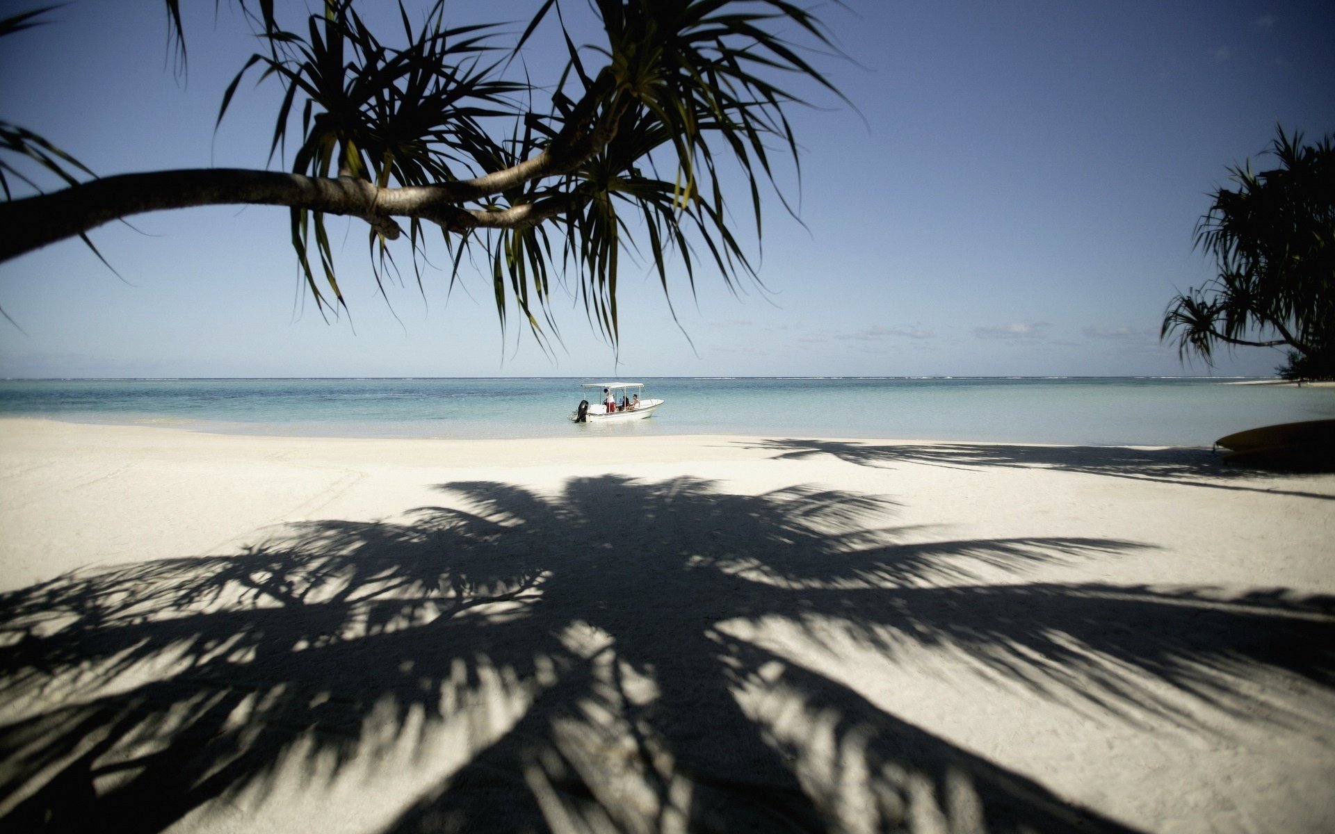 hadow on the sand boat tropical plants beach sand boat boat shore horizon surf nature tropics islands palm tree