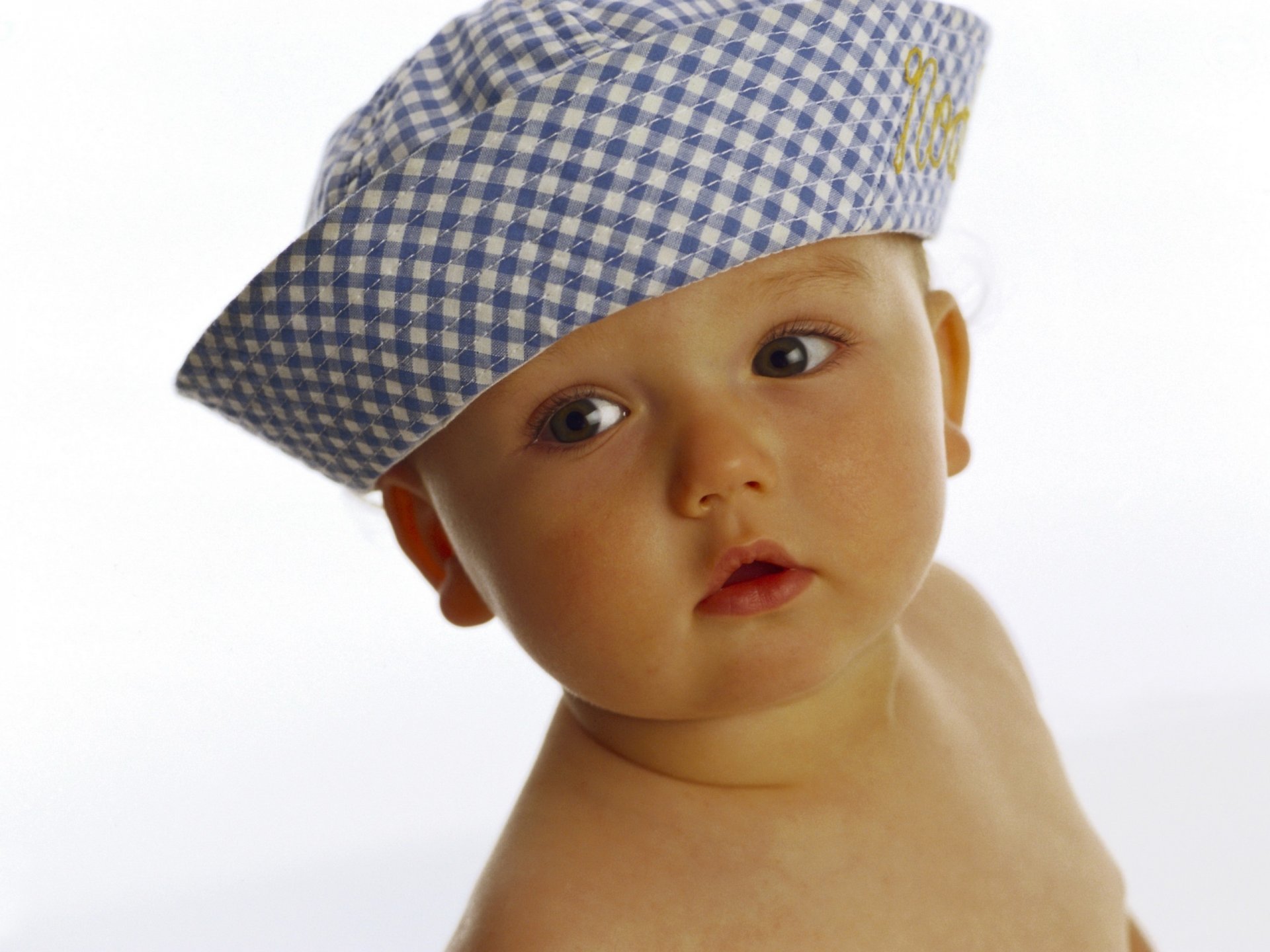 gorro azul bebé vista lateral retrato vista ojos fondo tocado miga bebé cara