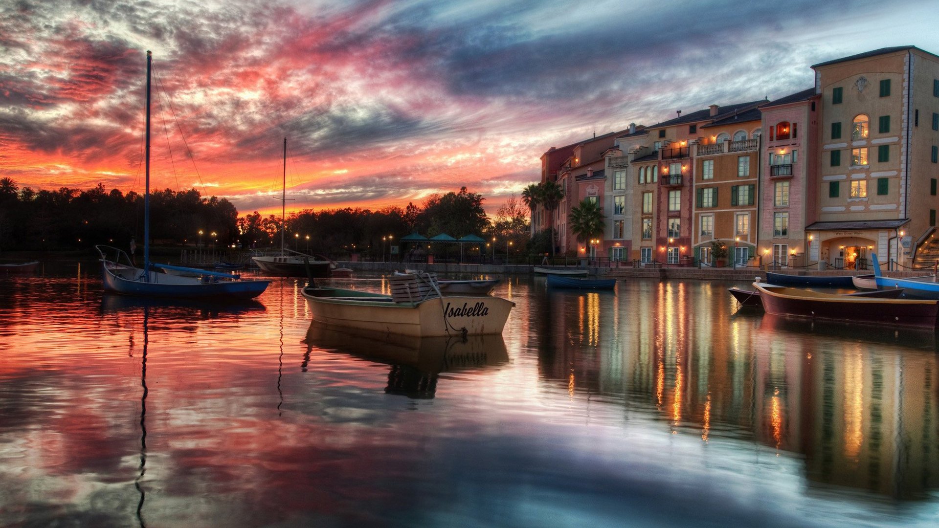 town on the water small boats sunset water river the sky building city the evening boats surface mirror reflection