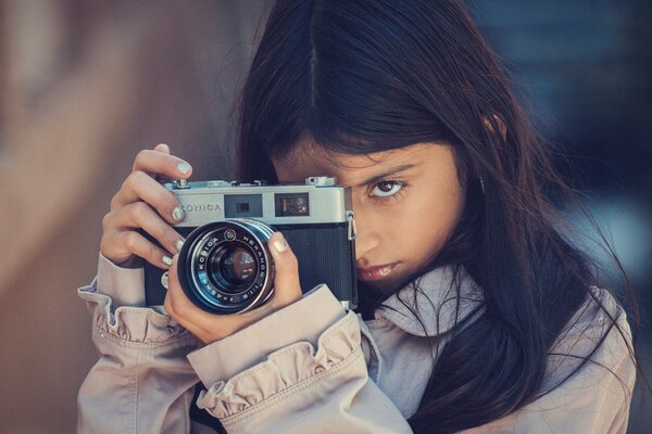 Photographing girl. konica camera