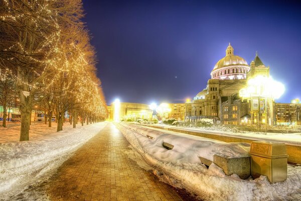 Cathedral with lights in the evening against the sky