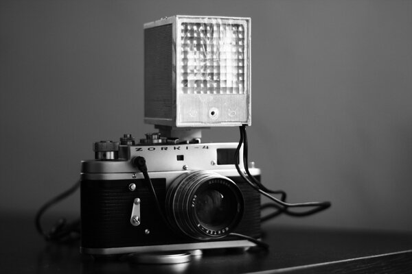 Camera with flash in a black case