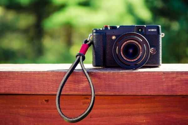 Photo of a camera against the background of nature