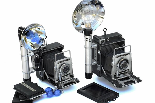 On a white background - vintage cameras with flashes