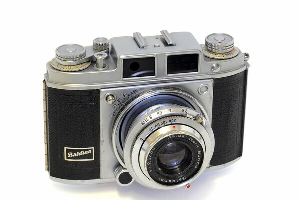 On a white background - retro film camera
