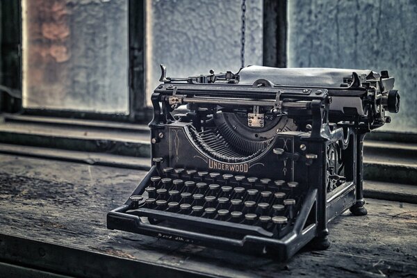 An old typewriter on the windowsill