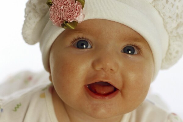 Charming little girl smiles in the portrait