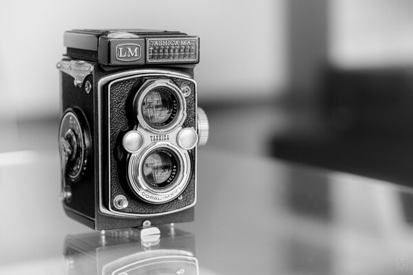Retro photo in black and white, an unusual thing - an old camera