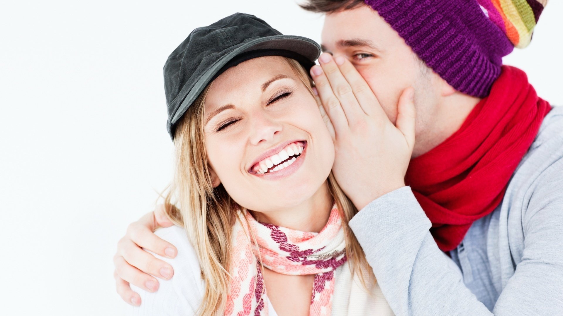 the feeling of love sincere smiles words in your ear spring pair lovers guy girl smile cold hats fun white background closed eyes emotions mood joy men women