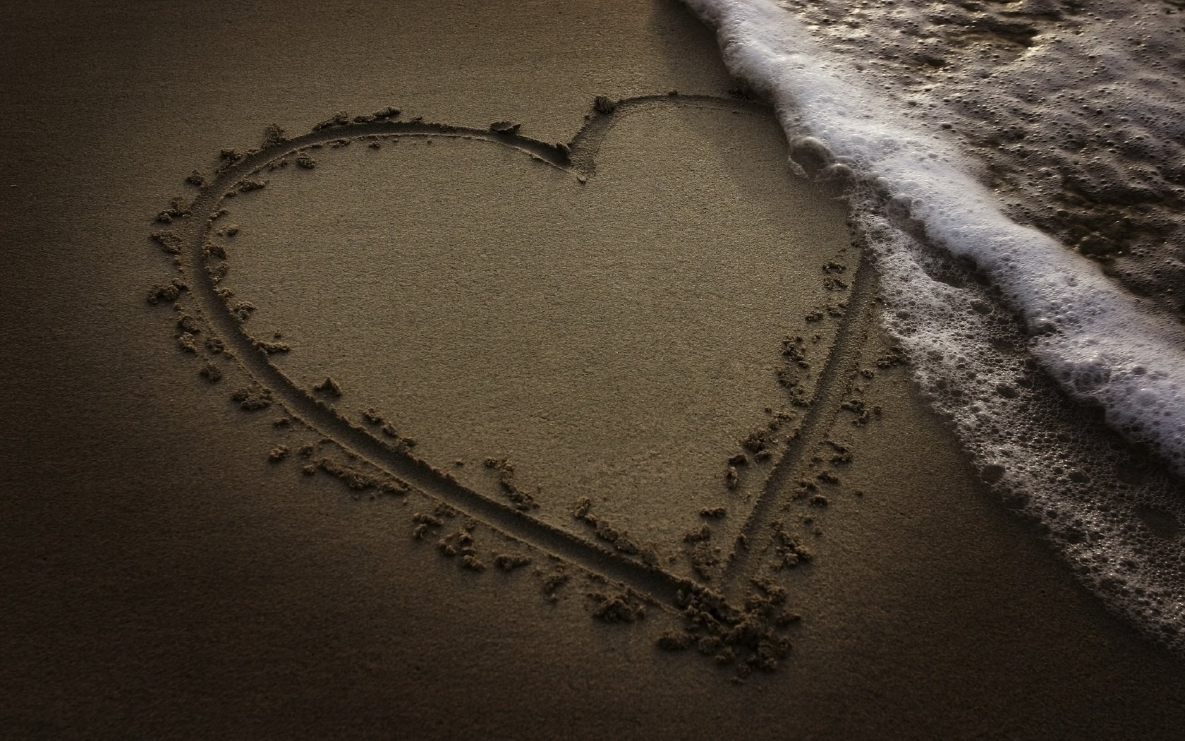 heart drawing in the sand the waves of the sea love romance recognition tenderness beach sea foam wave