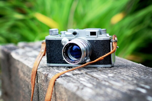 Retro camera on a wooden bar