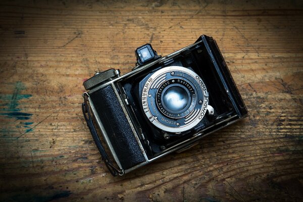 Antique camera on a wooden table