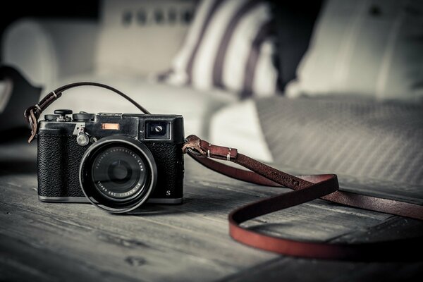 Camera with lens for macro shooting on a gray background