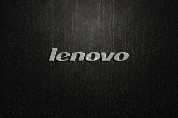 Серебряный логотип Lenovo на черном фоне