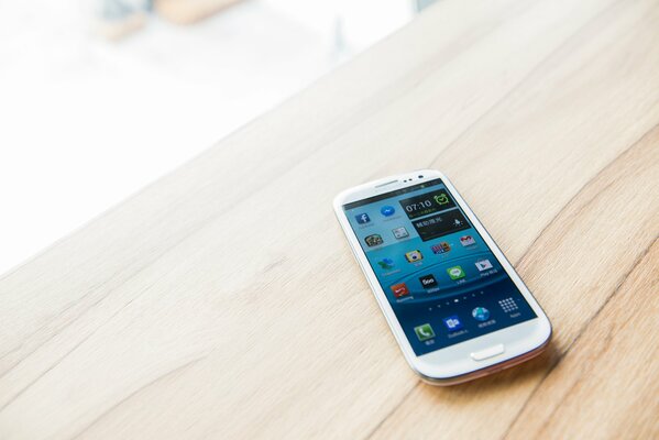 Android smartphone on a wooden table