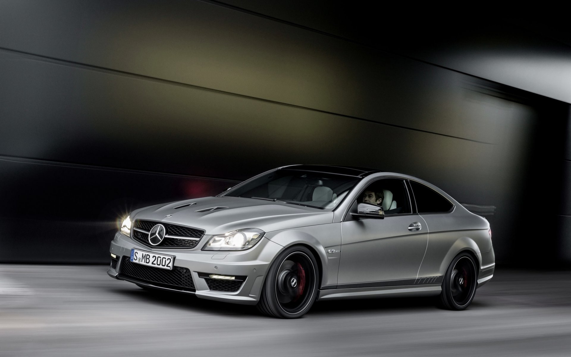 mercedes-benz c63 amg in motion car mercedes grey coupe driver