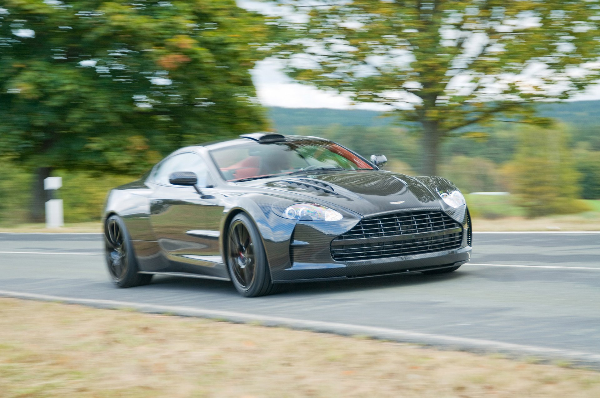 mansory cyrus aston martin db9 fast supercar road tree