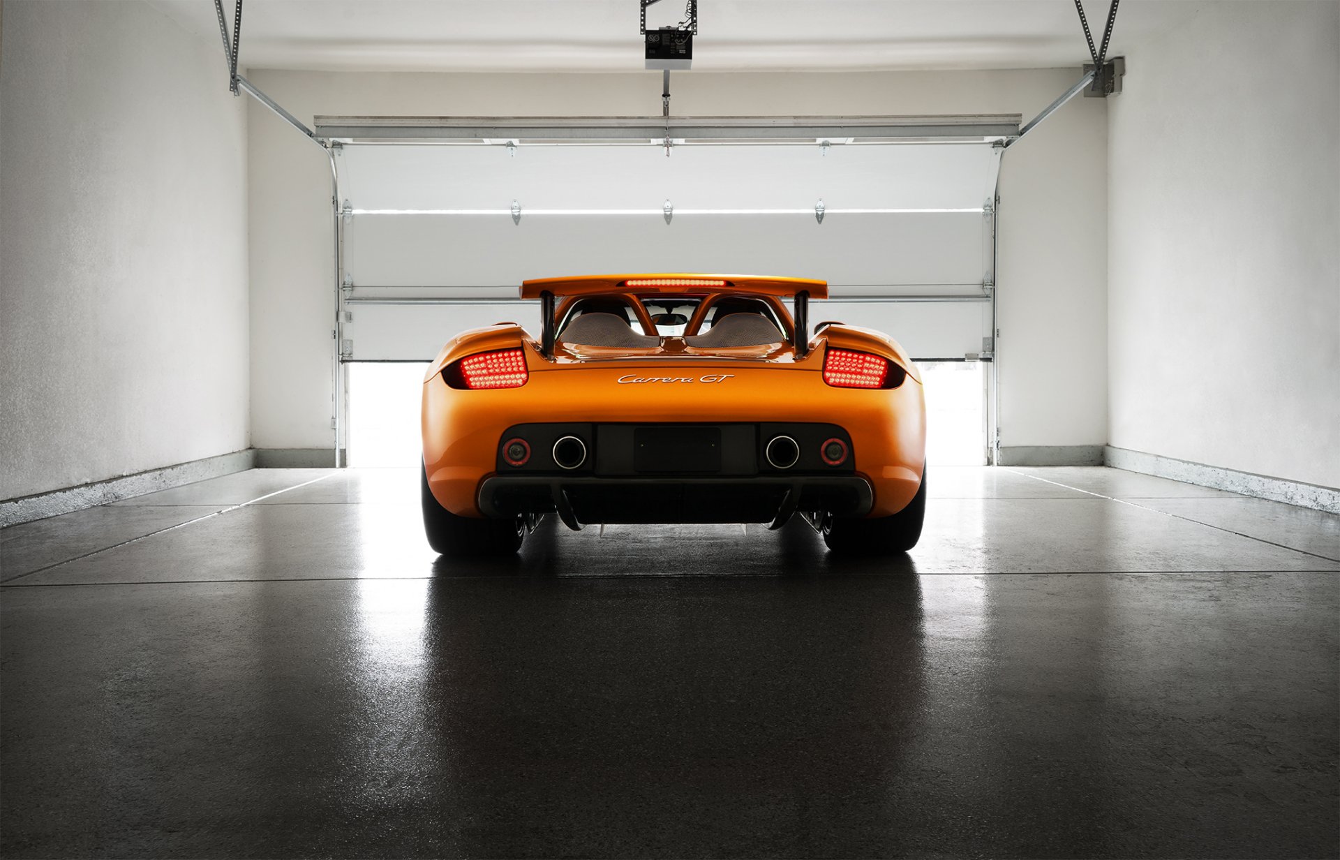 porsche carrera gt orange borealis exotique supercar lumière arrière