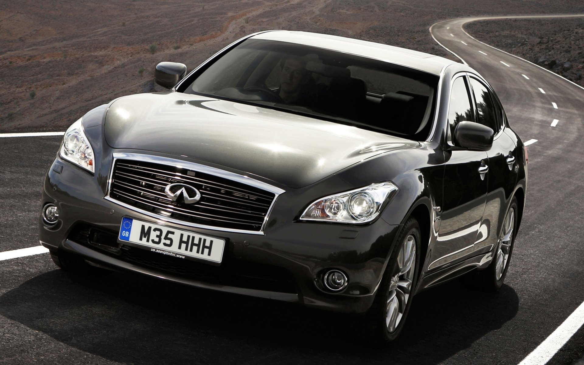 infiniti m35h infinity sedan front road