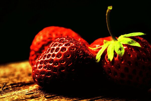 Fresh strawberries on a dark background