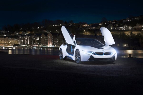 White bmw i8 with open doors on the background of the river wallpaper