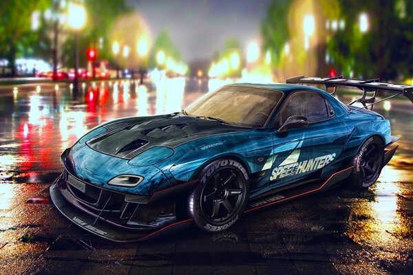 Azul mazda rx-7 speedhunters en el fondo del parque de la noche