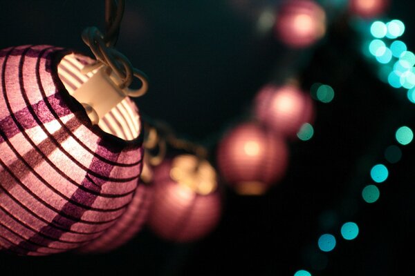 Pink Japanese lanterns on dark