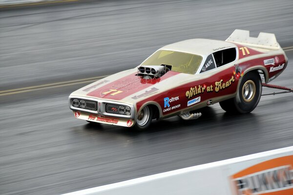 Drag racing muscle car race on the track