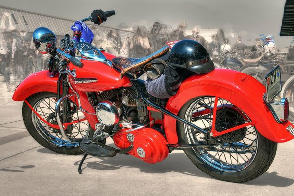 Red retro motorcycle with helmet