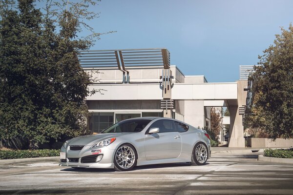 A parked car in the background of a building