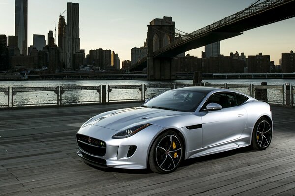 Silver Jaguar, f-type 2015 USA, background Manhattan