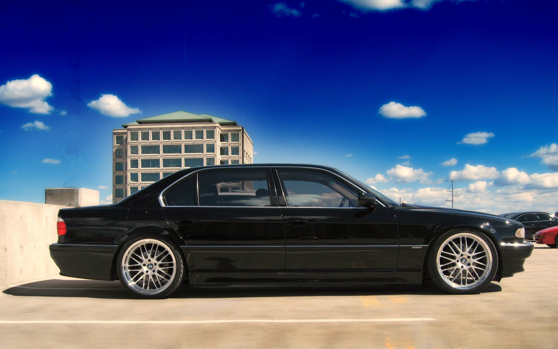 black e38 bmw bmw 750 seven auto photo sky blue clouds concrete parking building house profile black car passenger cars transport auto motor transport