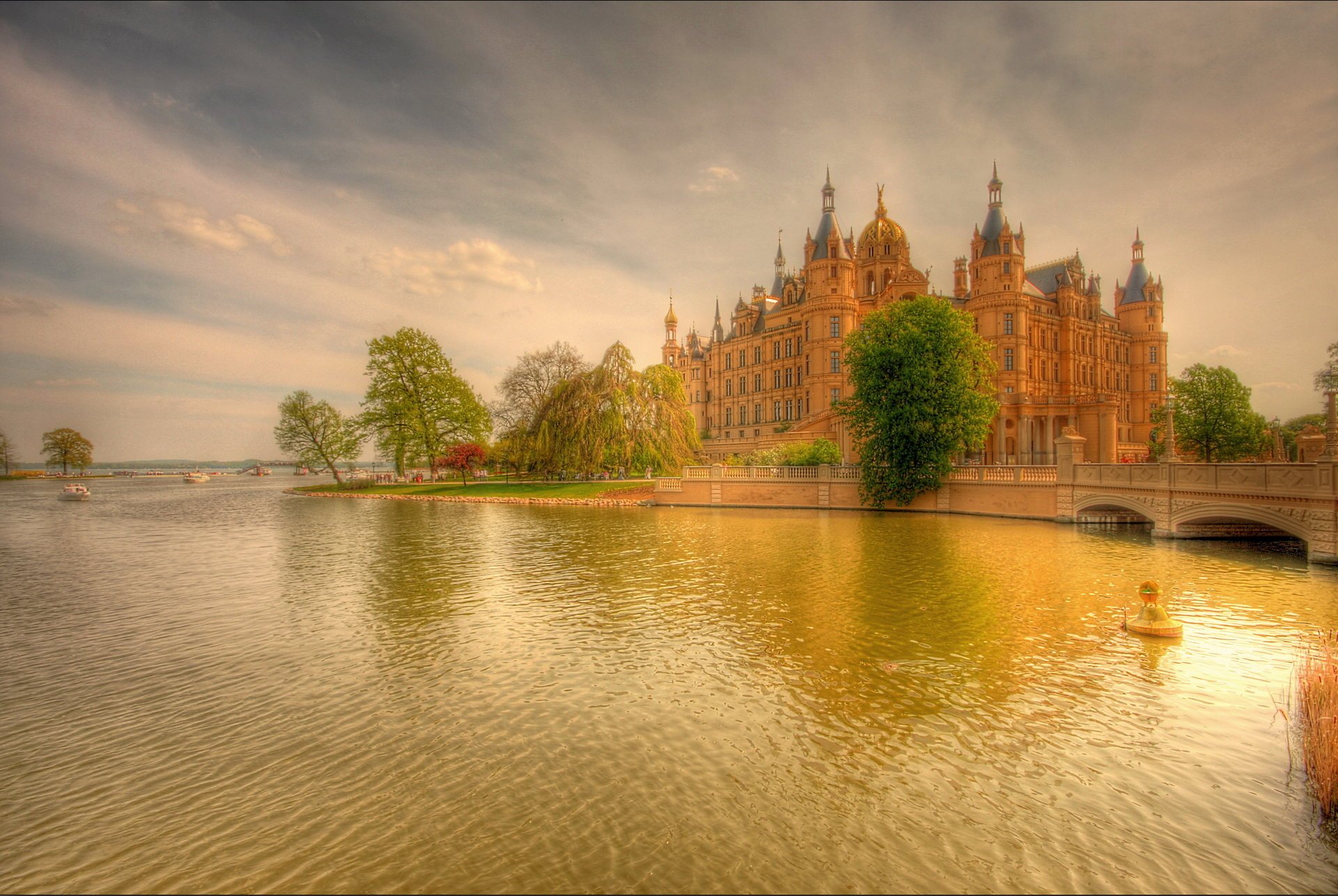 figure sunset river bridge boats trees castle