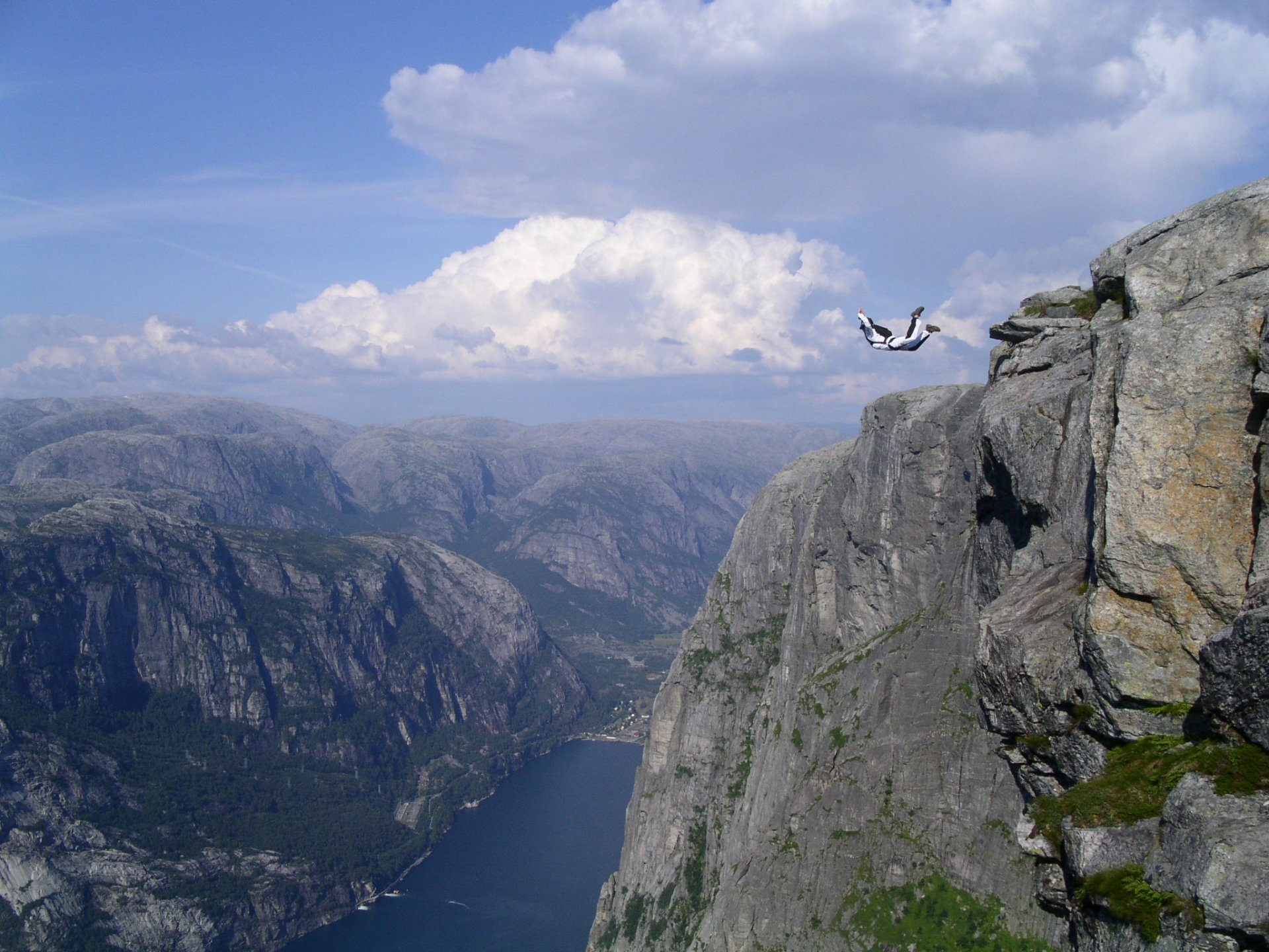 base jumping jump aviation mountains rocks adrenaline flight water the sky clouds height