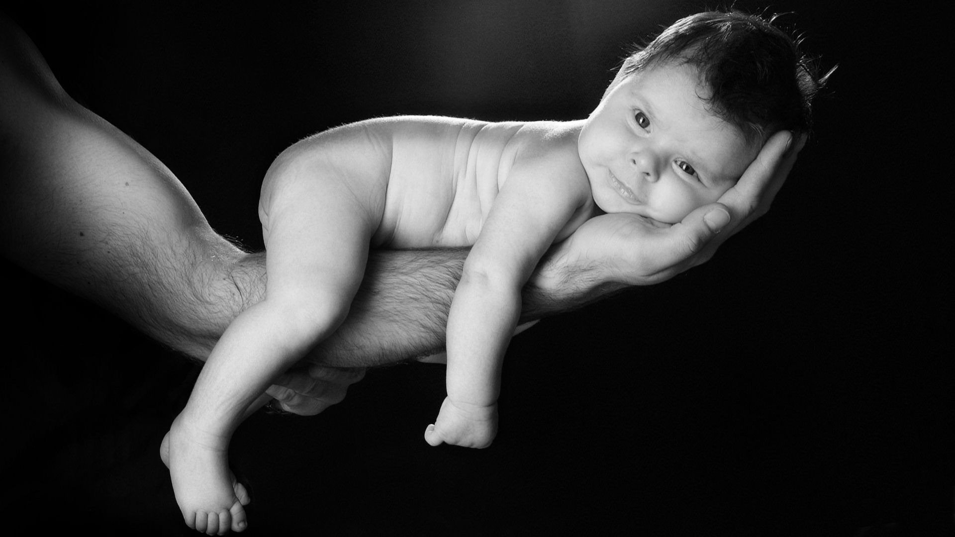 baby hand pose children look baby baby black background b-w eyes face black and white