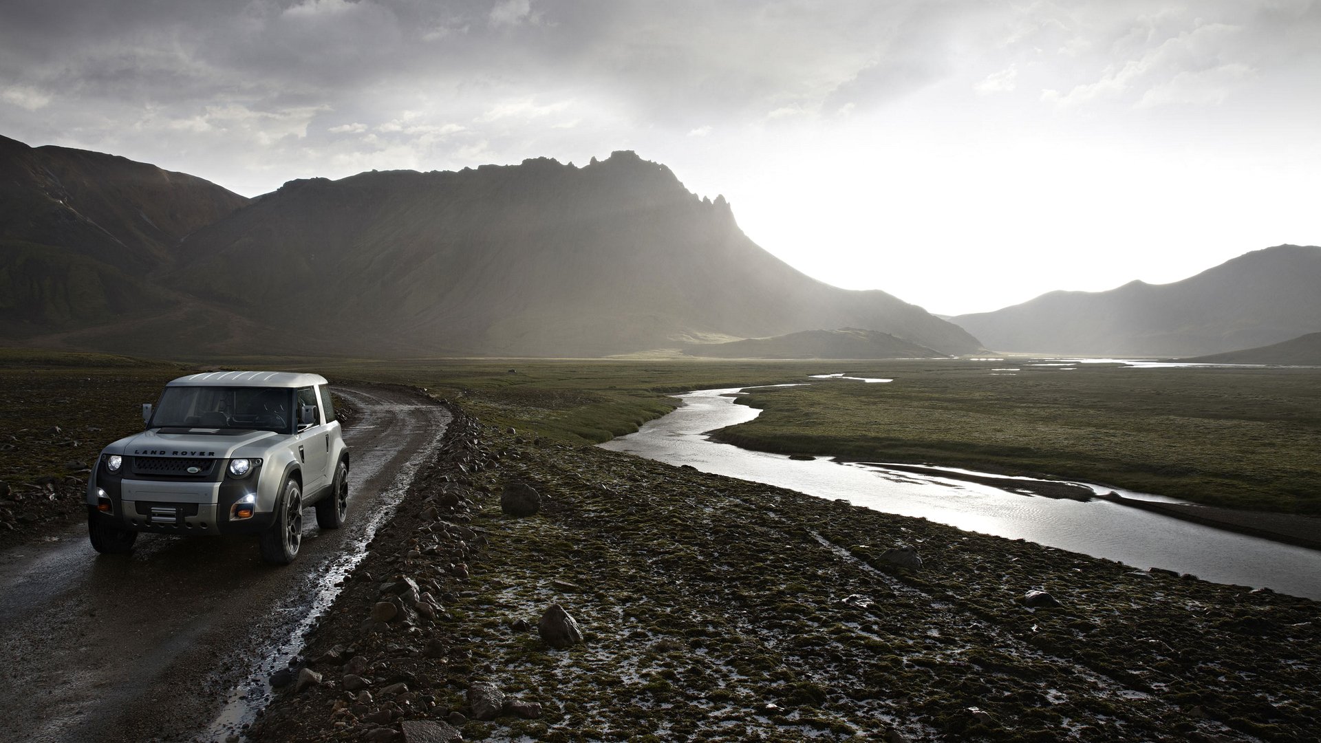 land rover dc100 montaña paisaje carretera arroyo