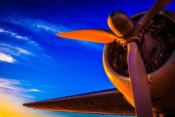 The engine of the plane in the sky is beautiful