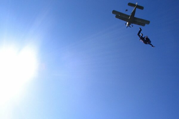 A skydiver jumps from an airplane for a parachute jump