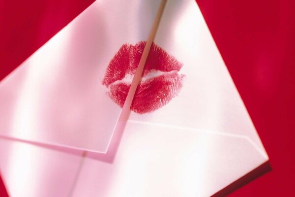 A white letter with scarlet lipstick on the envelope