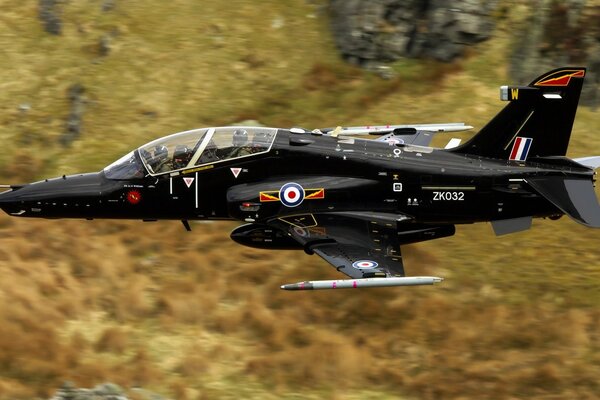 Black military aircraft in flight