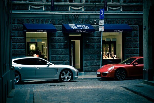 White and red car in a narrow street