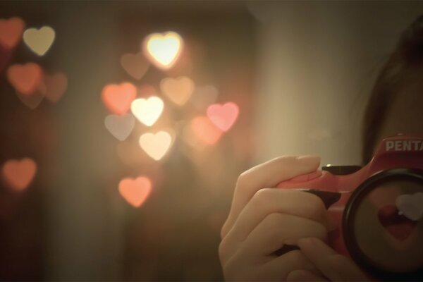 Lights in the form of hearts through the prism of the camera