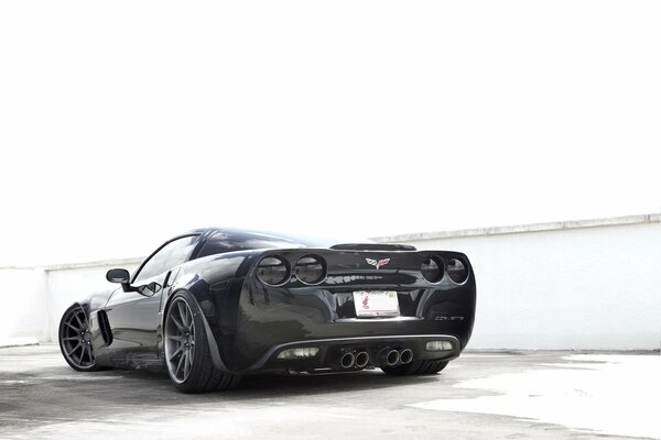 Black, sports car on the back side