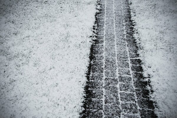 A clear track from the wheel in the snow