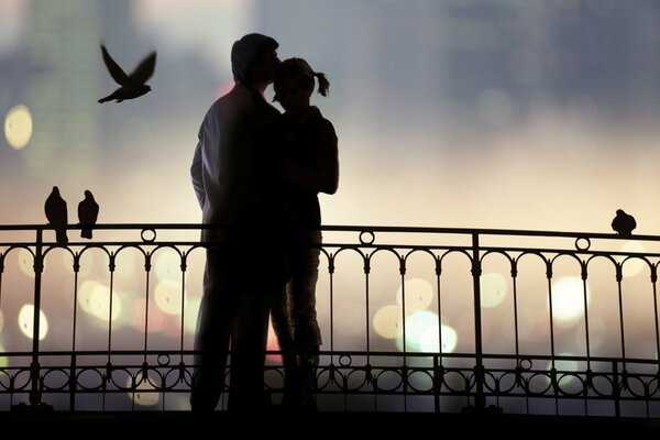 Romantic date of a couple on the bridge