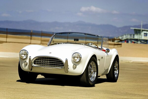 A car driving on a sunny beach