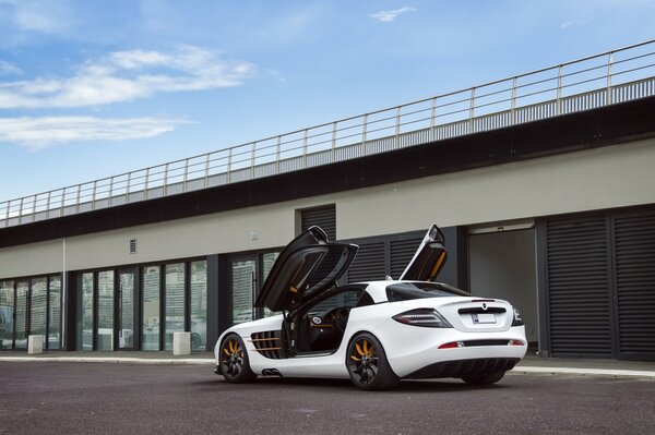 White Mercedes with open doors