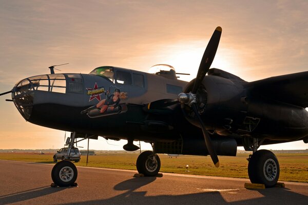 An old military helicopter at sunset time