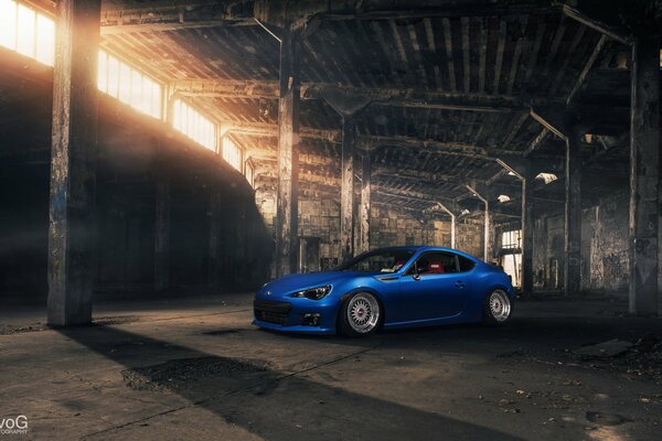 Subaru is in an abandoned garage